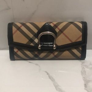 Burberry wallet. Some nicks and marks.